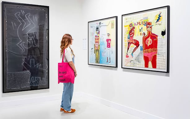 Visitor observing contemporary art at Moco Museum, Barcelona.