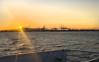 Sunset view of cranes at Los Angeles Harbor from a sightseeing cruise.