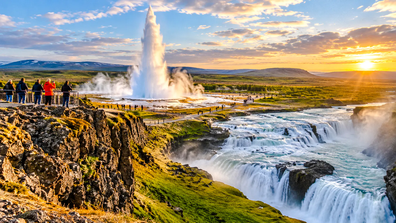 Geyser erupting near waterfalls in Iceland with tourists observing.