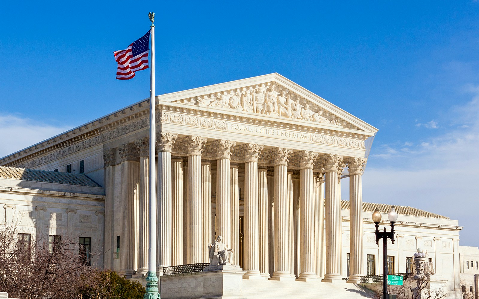 Supreme Court building with American flag, Washington DC.