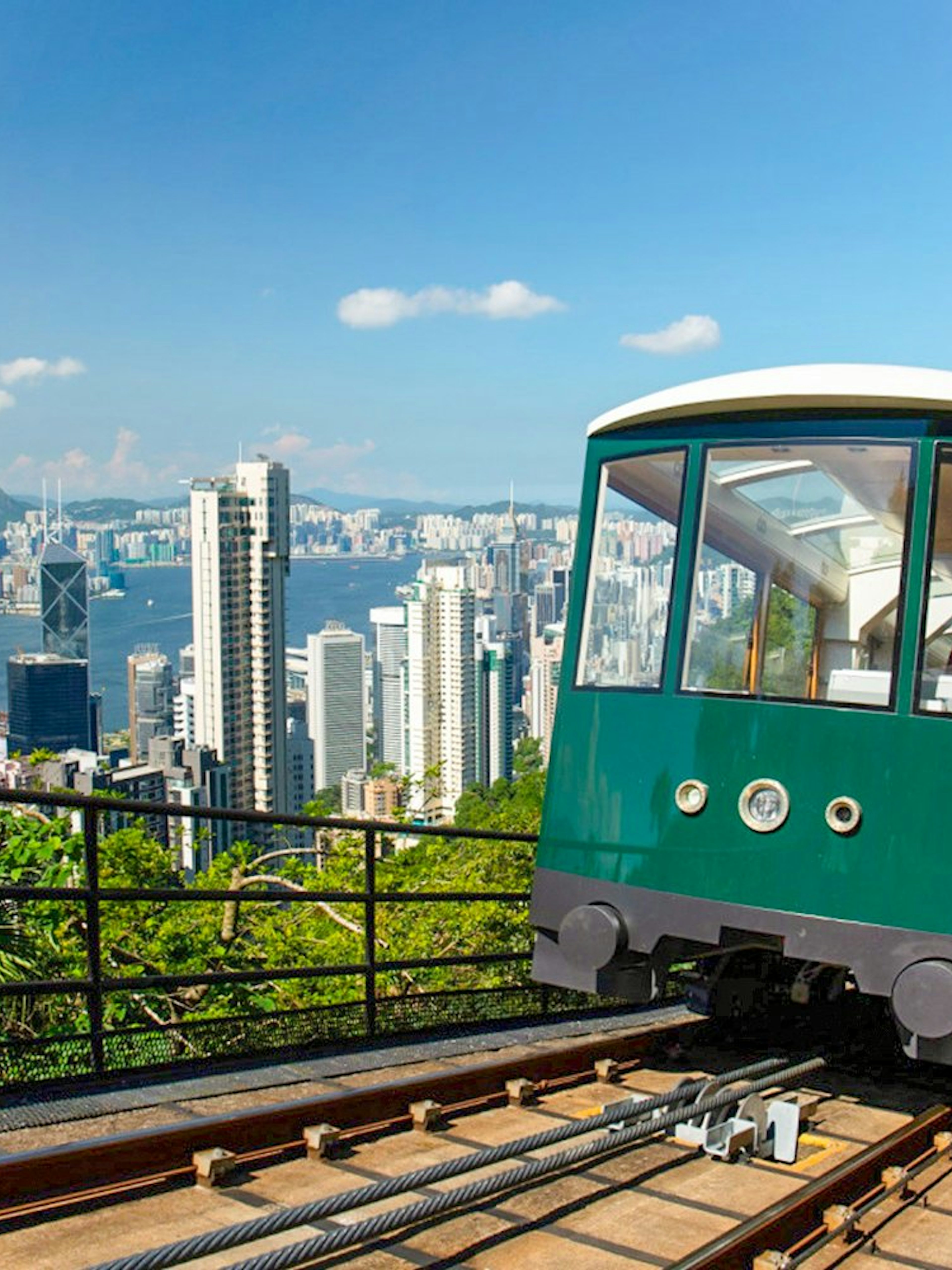 Peak Tram ascending with Hong Kong skyline view, part of Sky Pass experience.