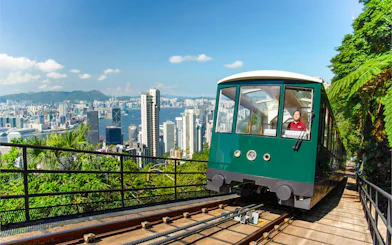 Peak Tram ascending with Hong Kong skyline view, part of Sky Pass experience.