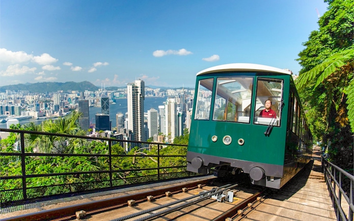 Peak Tram ascending with Hong Kong skyline view, part of Sky Pass experience.