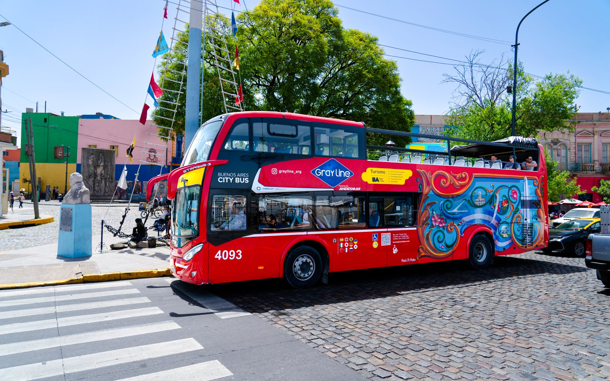 Buenos Aires hop-on hop-off bus in colorful La Boca neighborhood.