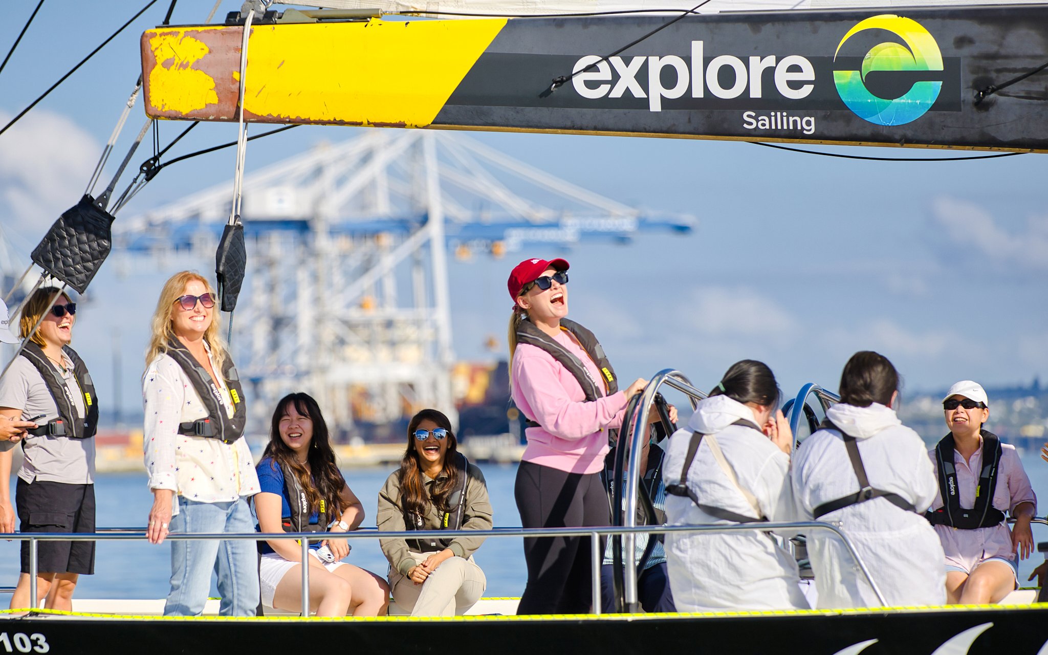 Participants enjoying America's Cup Sailing on Auckland's Waitemata Harbour.