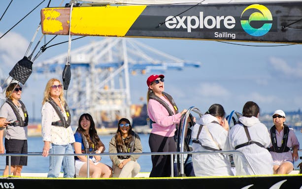 Participants enjoying America's Cup Sailing on Auckland's Waitemata Harbour.