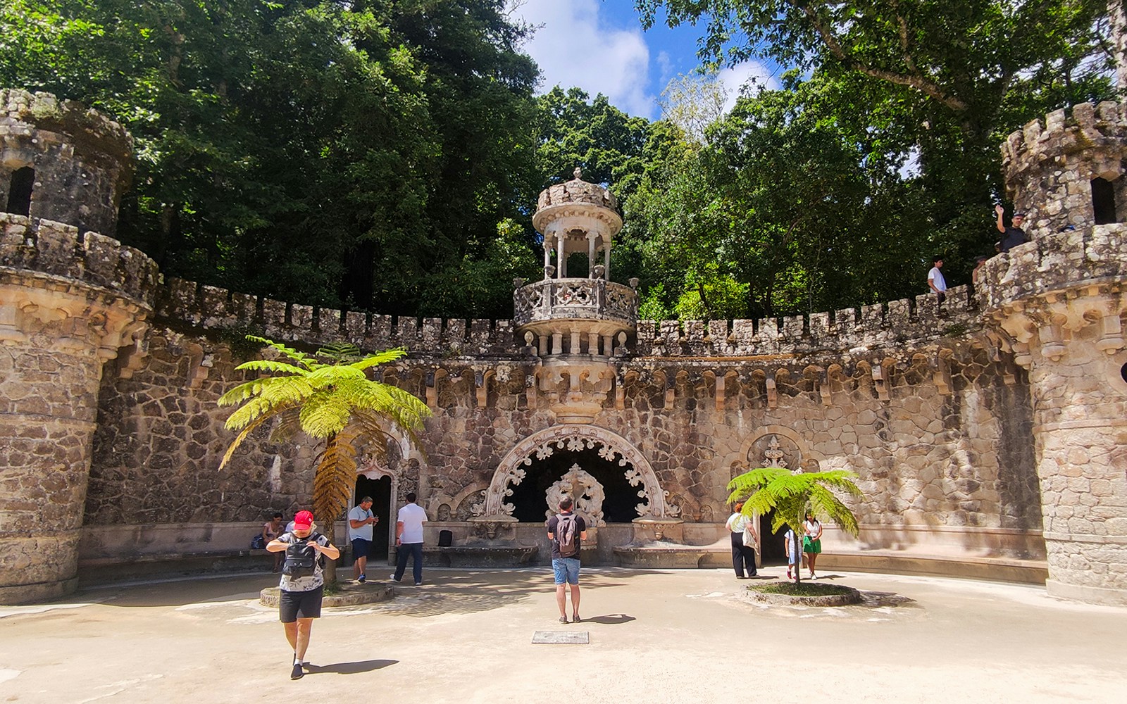 Quinta da Regaleira palace facade and gardens in Sintra during a guided tour.