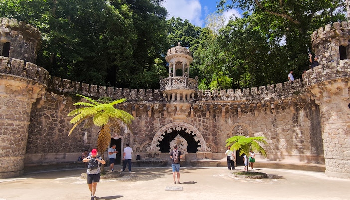 Quinta da Regaleira palace facade and gardens in Sintra during a guided tour.