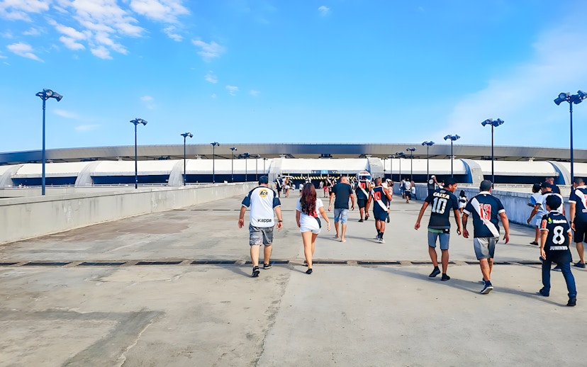Tourists walking towards Maracanã Stadium entrance in Brazil.