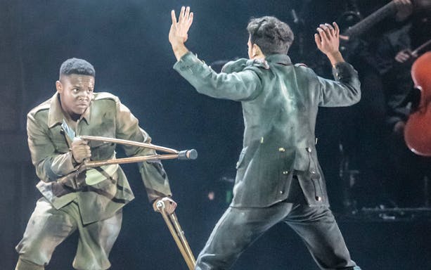 Actors in military attire perform a dramatic scene in "Peaky Blinders: The Redemption of Thomas Shelby.
