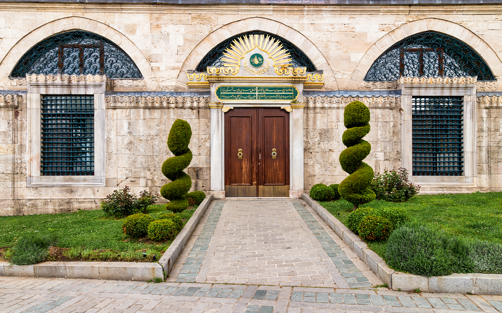 Hagia Sophia side entrances in Istanbul, showcasing historic architecture and intricate stonework.