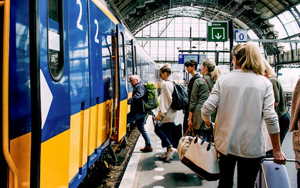 Passengers boarding a train at a station, Interrail Flexible Global Pass.