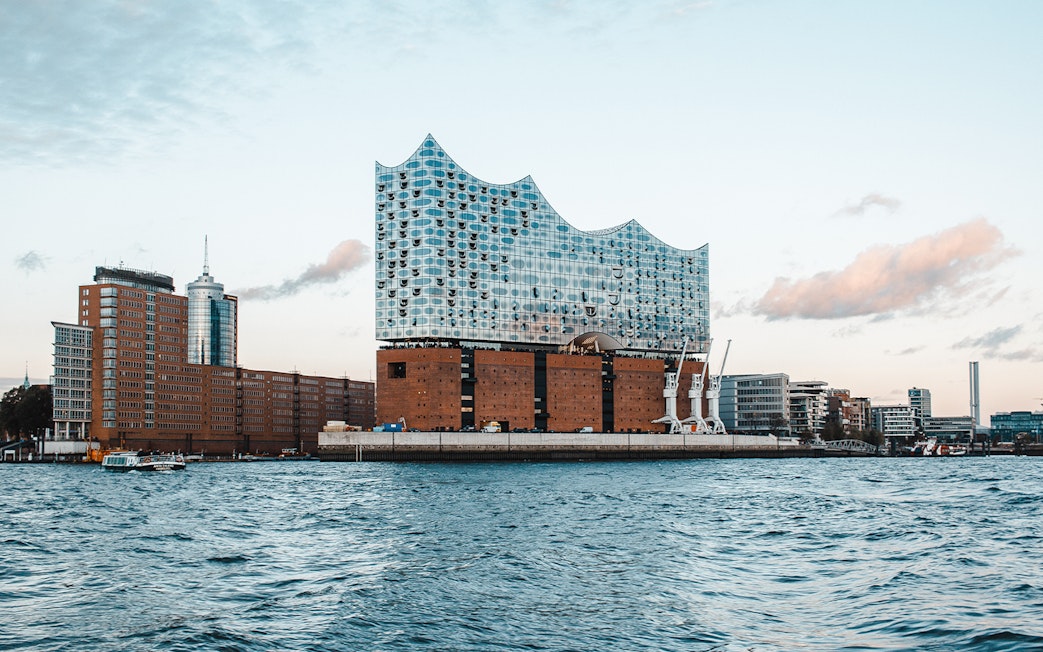 Elbphilharmonie building exterior in Hamburg, viewed from the water.