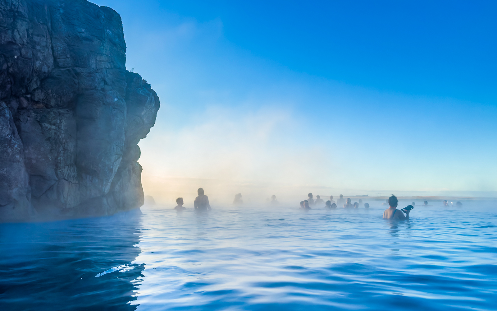 Sky Lagoon geothermal spa with steam rising, Reykjavik, Iceland, winter sunny day.