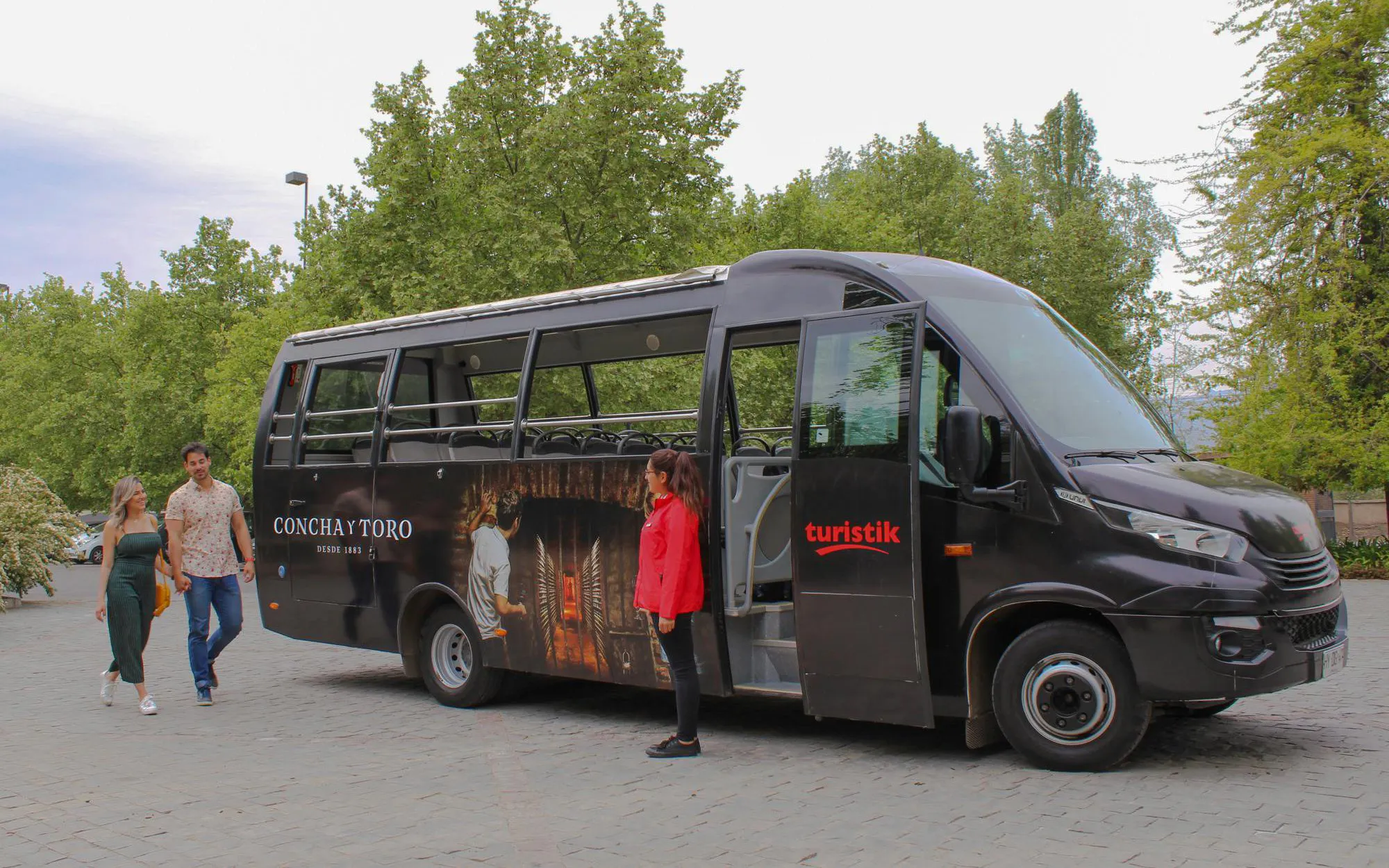 Tourists boarding bus for Concha y Toro Winery tour in Chile.