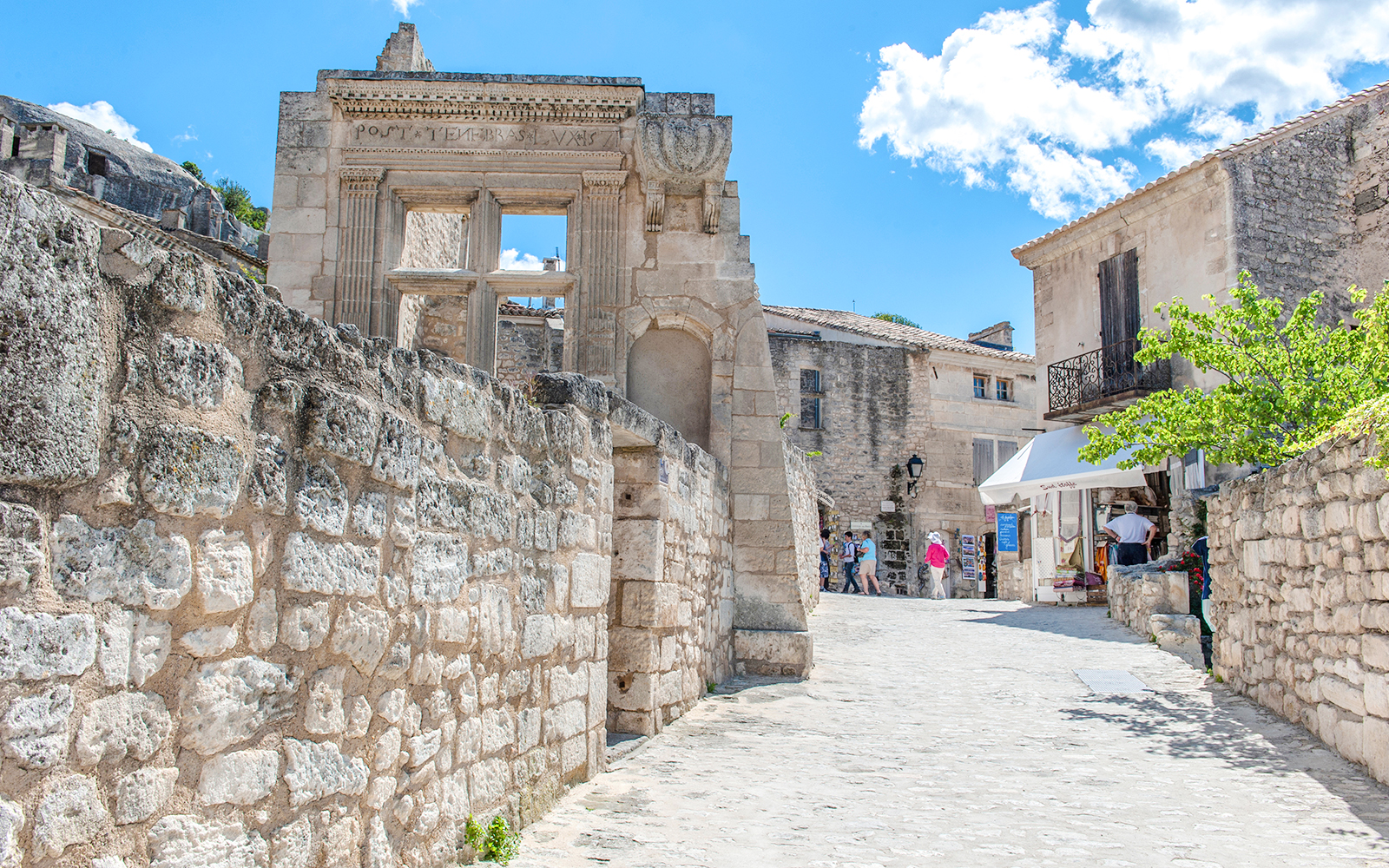 Ancient stone buildings and narrow street in Les Baux de Provence, France.