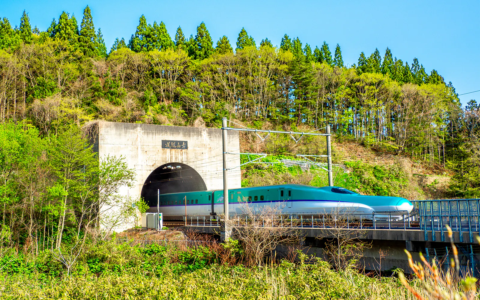 High-speed Hokkaido Shinkansen train entering Seikan Tunnel, Imabetsu, Aomori Prefecture, Japan.