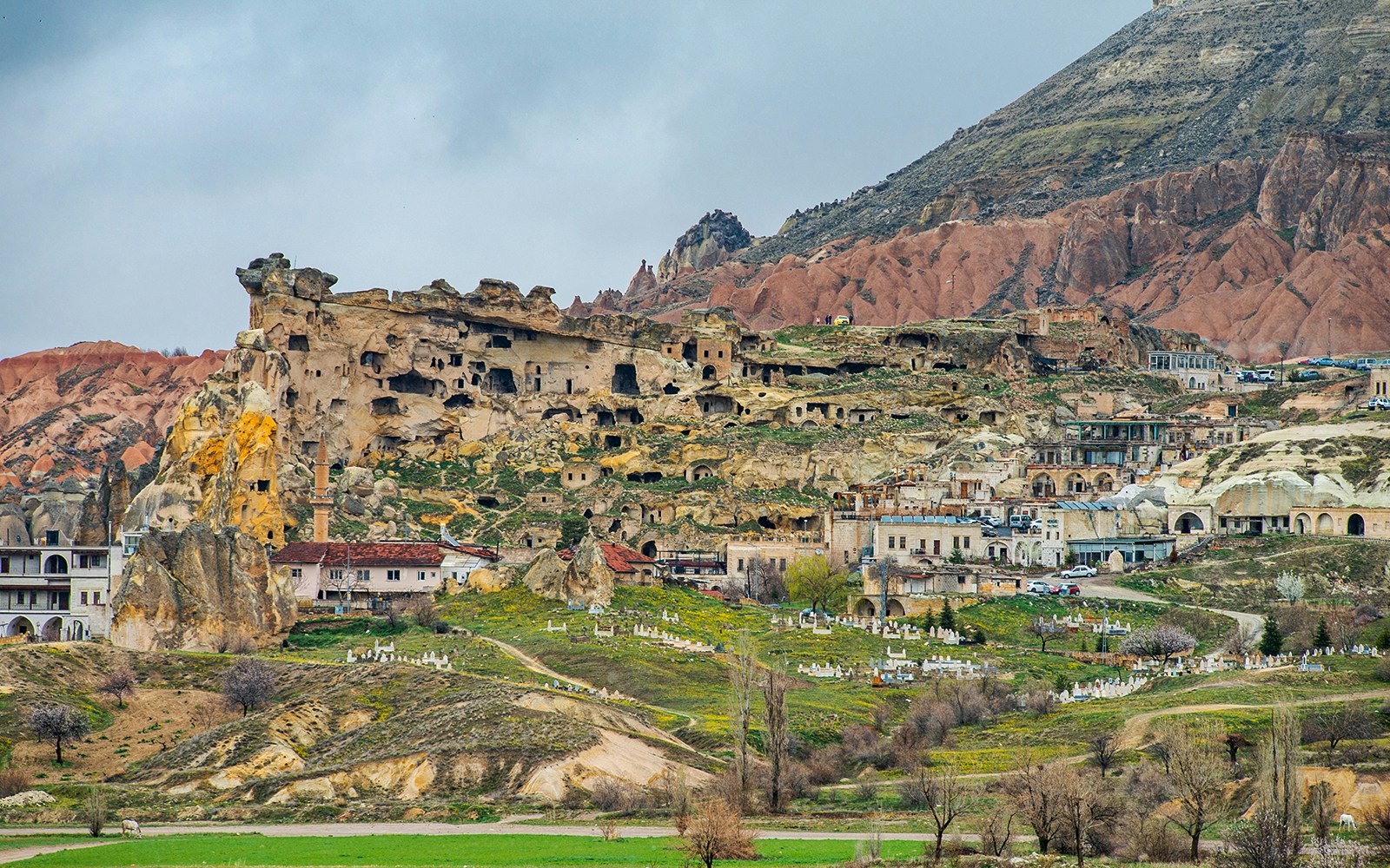 Rock formations and ancient dwellings in Çavuşin Village, Cappadocia.