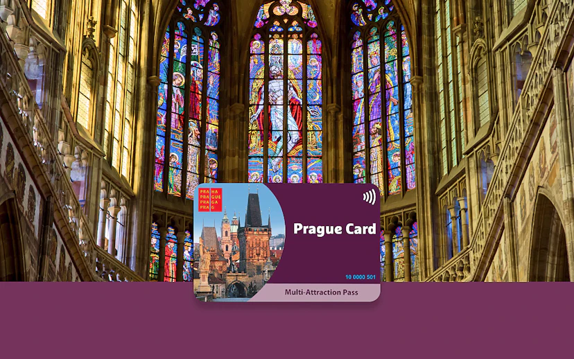 Prague Card displayed against stained glass windows in a historic cathedral.