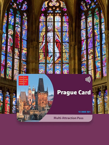 Prague Card displayed against stained glass windows in a historic cathedral.