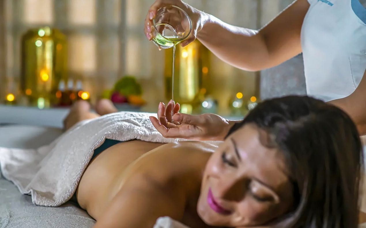 Massage therapy with oil at Pesterzsebet Bath, Budapest.