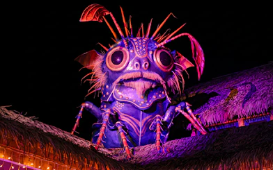 Giant insect sculpture illuminated at ZooParc de Beauval Halloween event.