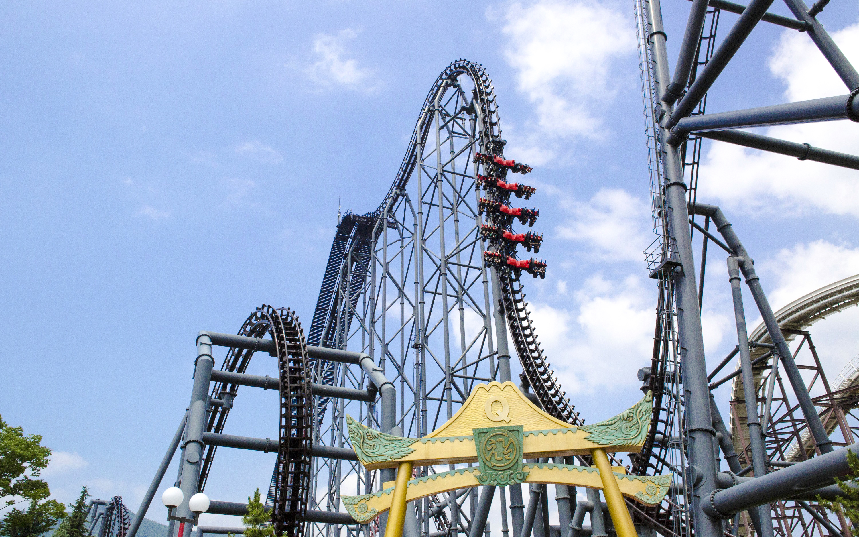 Eejanaika roller coaster at Fuji-Q Highland with riders on a steep drop.