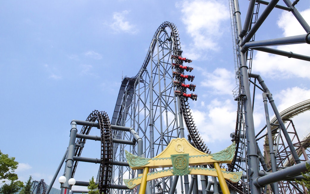 Eejanaika roller coaster at Fuji-Q Highland with riders on a steep drop.