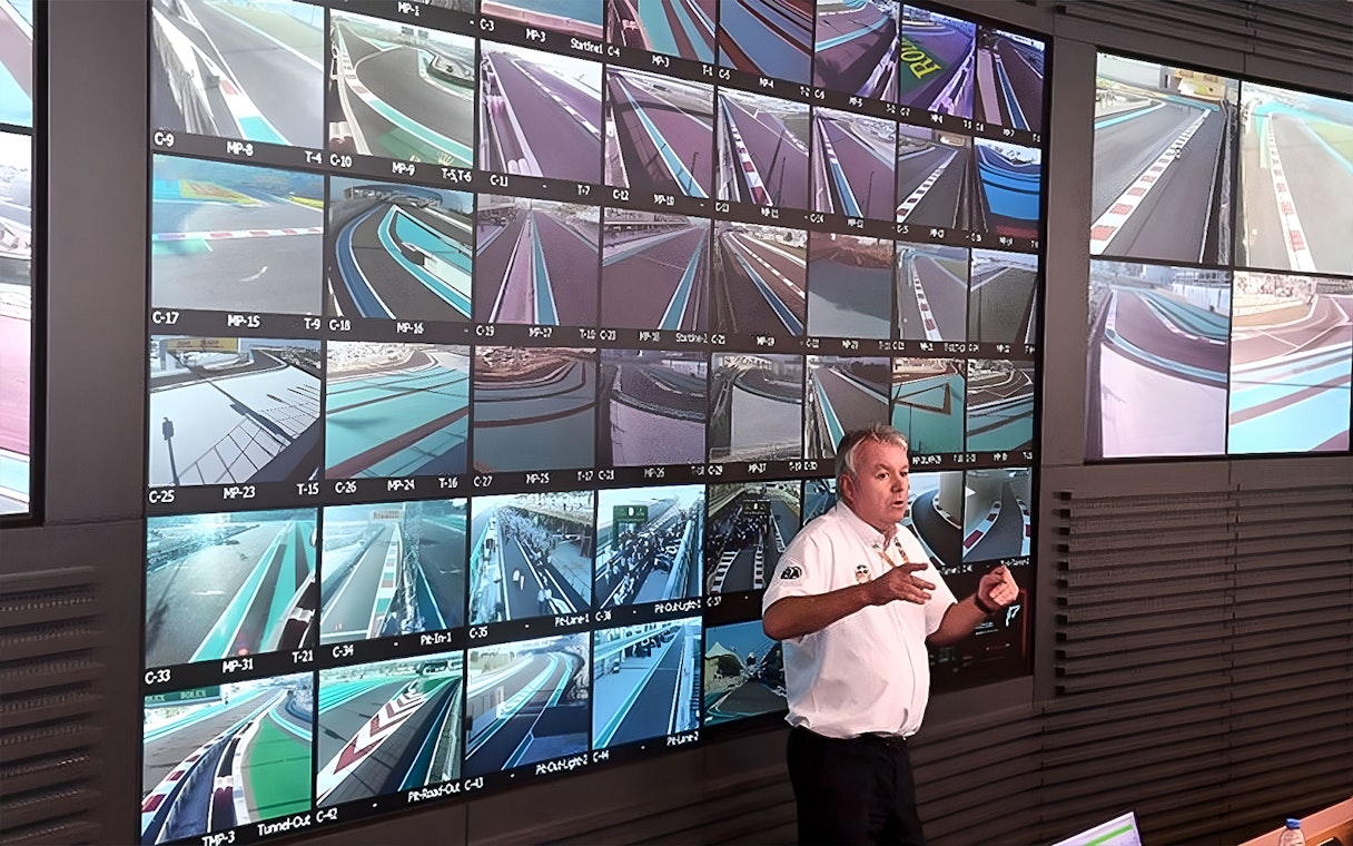 Guide explaining Yas Marina Circuit control room with multiple track monitors.