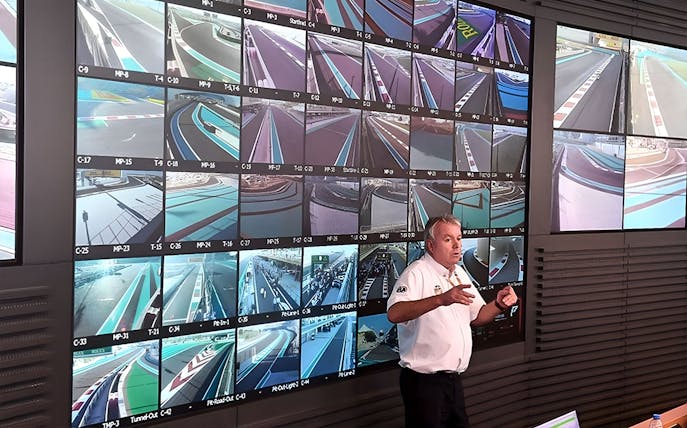 Guide explaining Yas Marina Circuit control room with multiple track monitors.