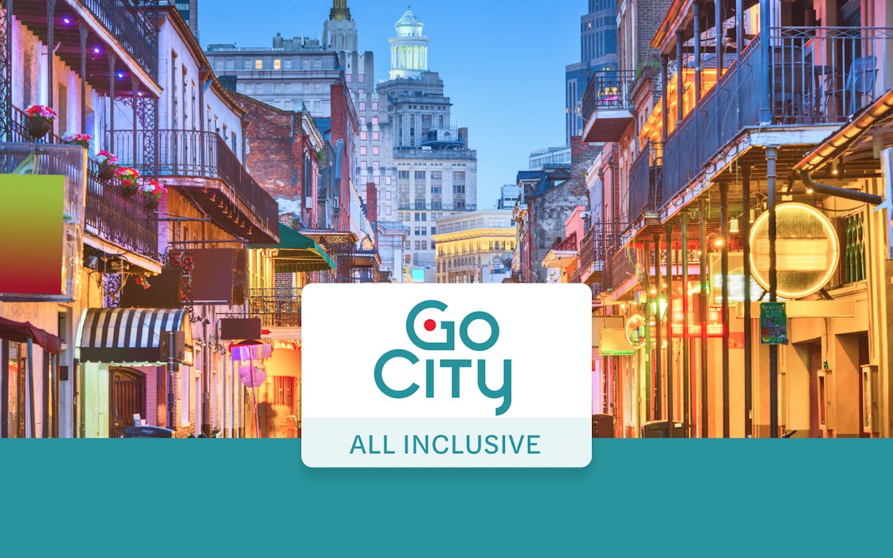 Bourbon Street in New Orleans with vibrant lights and historic architecture.