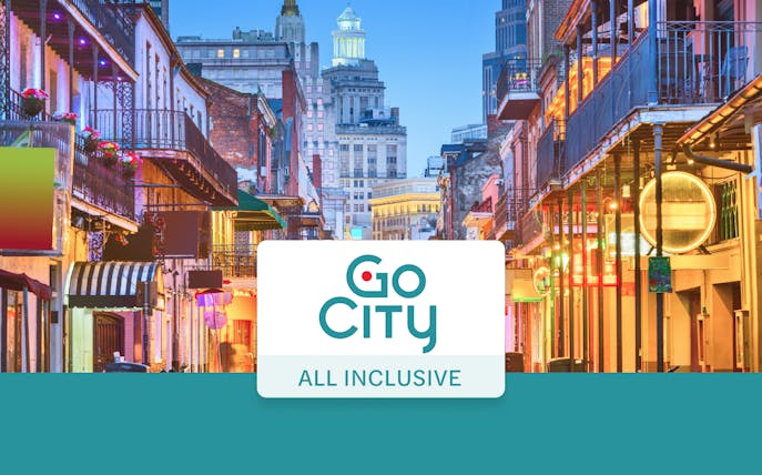 Bourbon Street in New Orleans with vibrant lights and historic architecture.