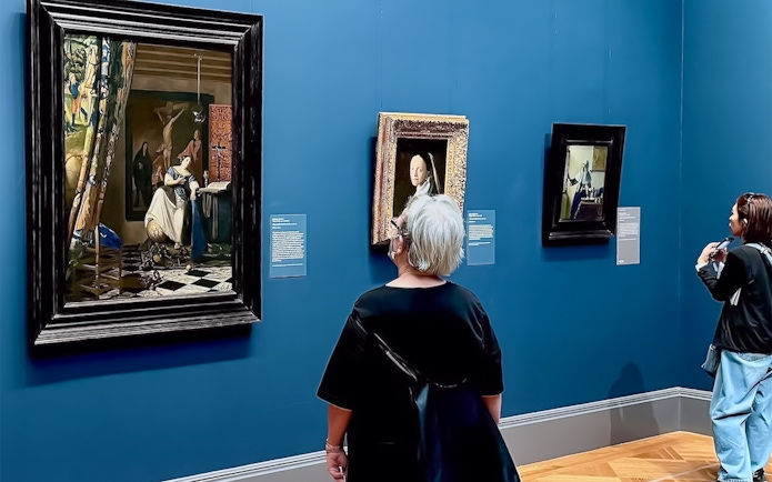 Visitors viewing paintings at The Met Museum during a pre-orientation tour.
