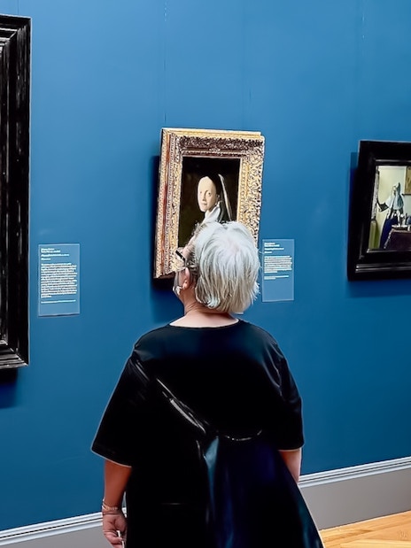 Visitors viewing paintings at The Met Museum during a pre-orientation tour.