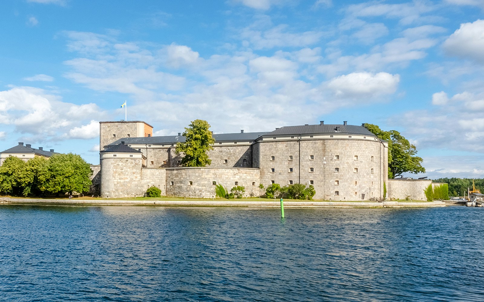 Vaxholms fortress viewed from an archipelago sightseeing cruise in Sweden.