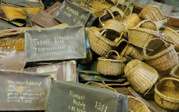 Luggage and baskets from Auschwitz exhibit on Krakow day tour.