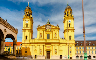 Theatinerkirche facade with twin towers in Munich, Germany.