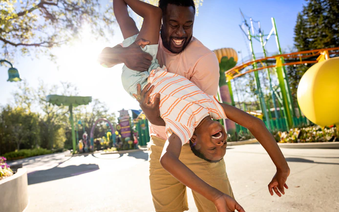 Father and child playing at Universal Kids Resort, Texas.
