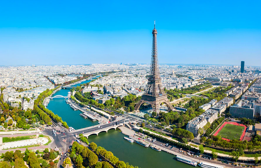 Eiffel Tower view over Paris with Seine River, ideal for elevator tour to summit or second floor.