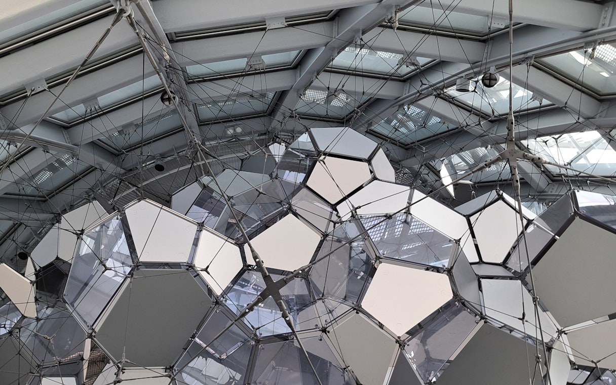 Geometric ceiling structure inside Glories Skyline Tower, Barcelona.