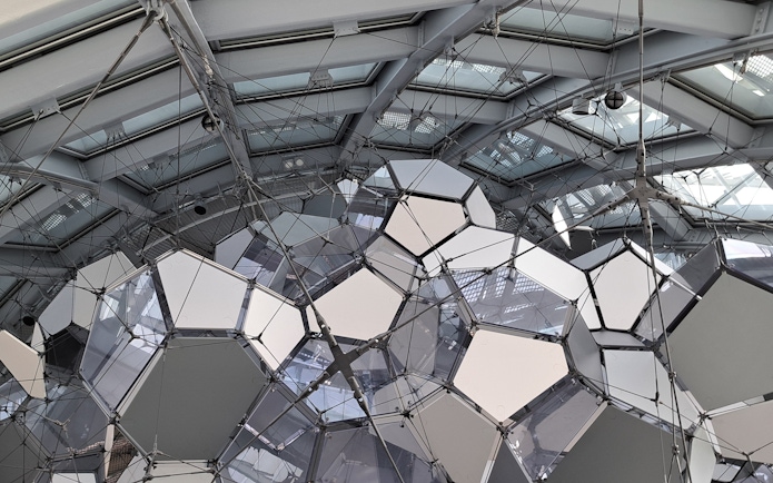 Geometric ceiling structure inside Glories Skyline Tower, Barcelona.