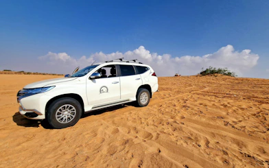4x4 vehicle on Sahara Desert sand dunes, Agadir adventure tour.