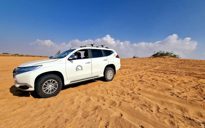 4x4 vehicle on Sahara Desert sand dunes, Agadir adventure tour.