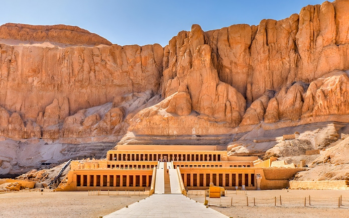 Mortuary Temple of Hatshepsut in Luxor, Egypt, with ancient columns and terraces.