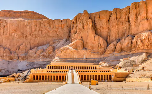 Mortuary Temple of Hatshepsut in Luxor, Egypt, with ancient columns and terraces.