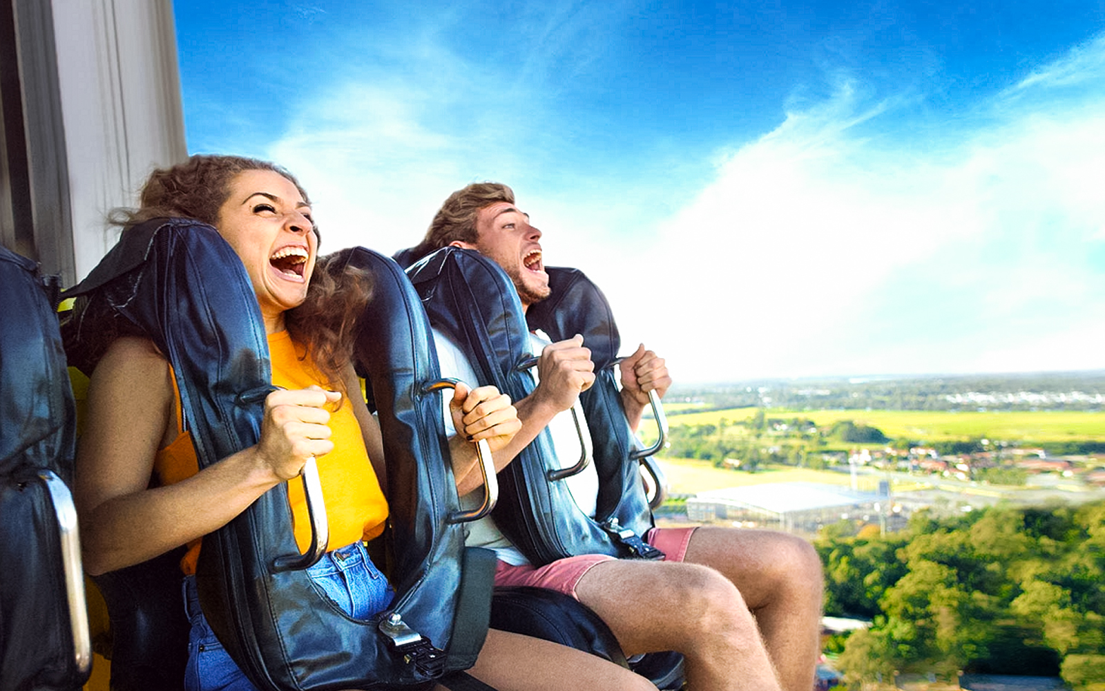 People enjoying a thrilling ride at Dreamworld amusement park.