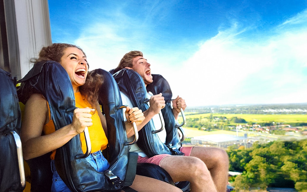 People enjoying a thrilling ride at Dreamworld amusement park.