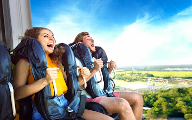 People enjoying a thrilling ride at Dreamworld amusement park.