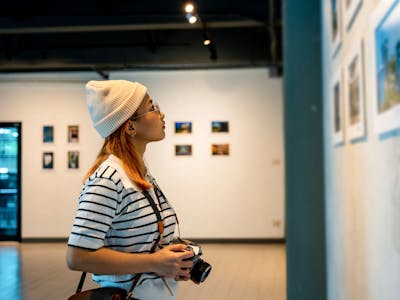 Girl observing artwork in Manarat Al Saadiyat
