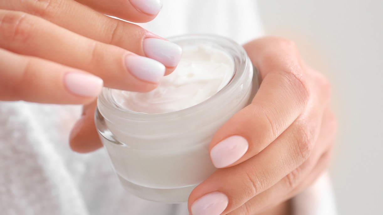 Woman with jar of Moisturizer